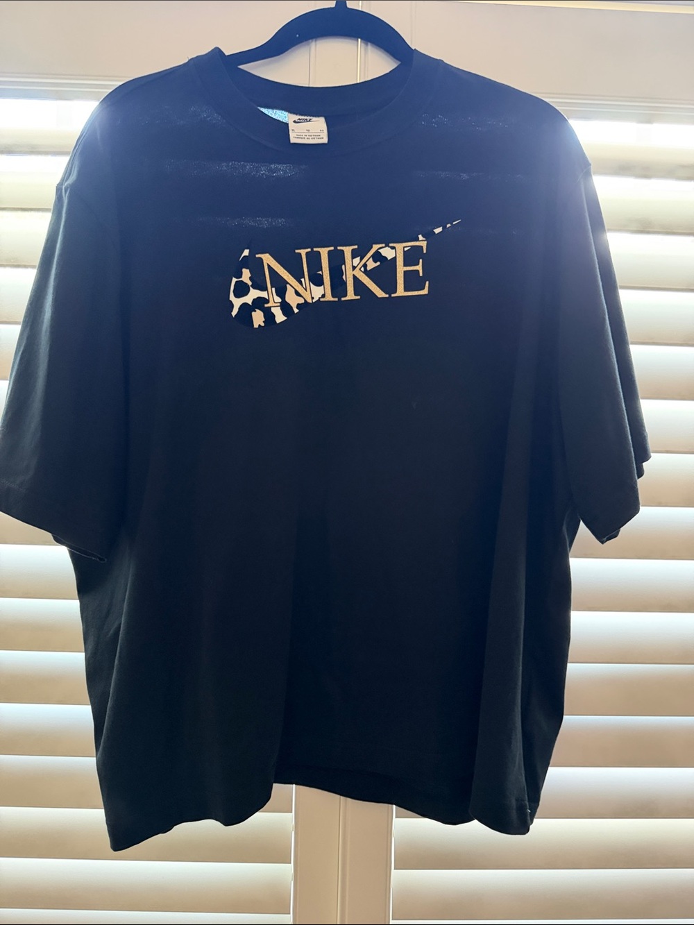 Nike Black Tee with Cream Cutout Swoosh Graphic